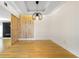 Dining room features hardwood floors and decorative wood panel at 1924 Variations Ne Dr, Atlanta, GA 30329