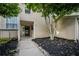 Inviting exterior of home featuring tidy landscaping and covered entryway at 1924 Variations Ne Dr, Atlanta, GA 30329