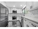 Modern kitchen featuring stainless steel appliances, white cabinets, and a subway tile backsplash at 1924 Variations Ne Dr, Atlanta, GA 30329