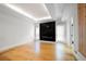 Bright living room with hardwood floors, a black fireplace and decorative wood panel at 1924 Variations Ne Dr, Atlanta, GA 30329
