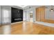 Bright living room with hardwood floors, a black fireplace and decorative wood panel at 1924 Variations Ne Dr, Atlanta, GA 30329