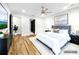 Staged main bedroom with hardwood floors, gray accents, and neutral decor at 1924 Variations Ne Dr, Atlanta, GA 30329