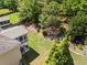 An aerial view of the backyard, highlighting the well-kept lawn, garden beds, and mature trees at 237 Parc Drive Dr, Canton, GA 30114