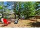 Relaxing backyard setup with lawn chairs, picnic table, and fire pit, perfect for outdoor entertaining at 237 Parc Drive Dr, Canton, GA 30114