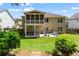 Well-maintained backyard with a screened porch, patio area, and ample seating for outdoor relaxation and entertaining at 237 Parc Drive Dr, Canton, GA 30114