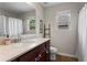 Bathroom boasts a single sink vanity, toilet, and shower with linen curtain at 237 Parc Drive Dr, Canton, GA 30114