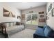 Bright bedroom featuring neutral walls, a comfortable bed, a window view to the outdoors, and tasteful decor at 237 Parc Drive Dr, Canton, GA 30114