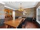 Elegant dining room features a coffered ceiling, hardwood floors, vintage wallpaper and a chandelier, perfect for Gathering gatherings at 237 Parc Drive Dr, Canton, GA 30114