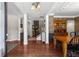 Inviting entryway featuring beautiful hardwood floors, elegant columns, and an open floor plan to the dining room and staircase at 237 Parc Drive Dr, Canton, GA 30114