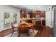 Eat-in kitchen featuring stainless steel appliances, dark wood cabinetry, and access to the backyard at 237 Parc Drive Dr, Canton, GA 30114