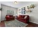 Cozy living room with plush sofas, decorative shelves and a large window offering natural light at 237 Parc Drive Dr, Canton, GA 30114