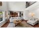 Comfortable living room with hardwood floors, a view to the kitchen, and a high ceiling at 237 Parc Drive Dr, Canton, GA 30114