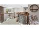 Upstairs loft area featuring a unique stone wall, view of the backyard, decorative chair and stylish railings at 237 Parc Drive Dr, Canton, GA 30114