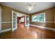 Bright bedroom featuring hardwood floors, white trim, and double french doors at 1276 Lanier Ne Blvd, Atlanta, GA 30306