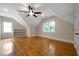 Large bedroom with hardwood floors, ceiling fan, and built-in shelving at 1276 Lanier Ne Blvd, Atlanta, GA 30306