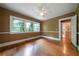 Bright bedroom featuring hardwood floors, white trim, and tree top views at 1276 Lanier Ne Blvd, Atlanta, GA 30306