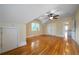 Spacious bedroom with hardwood floors, ceiling fan, and large closet space at 1276 Lanier Ne Blvd, Atlanta, GA 30306