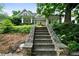 Charming two-story home with stone stairs, landscaped yard, and covered front porch at 1276 Lanier Ne Blvd, Atlanta, GA 30306