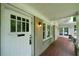 Charming front porch with brick flooring, white columns, and an inviting entrance at 1276 Lanier Ne Blvd, Atlanta, GA 30306