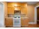 A view of the kitchen featuring an oven/range, light wood cabinets, and tiled floors at 1276 Lanier Ne Blvd, Atlanta, GA 30306
