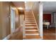 View of staircase with wooden steps, white risers and banister in a home with hardwood floors at 1276 Lanier Ne Blvd, Atlanta, GA 30306