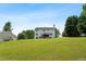 Spacious backyard featuring a house with a deck, ideal for outdoor activities and relaxation at 140 Melrose Creek Dr, Stockbridge, GA 30281
