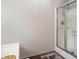 Bathroom features a shower with glass doors and hardwood floor at 140 Melrose Creek Dr, Stockbridge, GA 30281