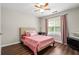 Bedroom with hardwood floors and bright window at 140 Melrose Creek Dr, Stockbridge, GA 30281