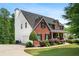 Two-story brick home featuring attached garage, and verdant lawn at 140 Melrose Creek Dr, Stockbridge, GA 30281