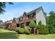 Attractive red brick house with a charming front porch and manicured landscaping at 140 Melrose Creek Dr, Stockbridge, GA 30281