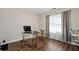 Charming home office features a gold desk, window, and hardwood floor at 140 Melrose Creek Dr, Stockbridge, GA 30281