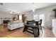 Cozy living room with fireplace, ceiling fan, hardwood floors, and furniture at 140 Melrose Creek Dr, Stockbridge, GA 30281