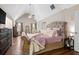 Bright main bedroom featuring vaulted ceiling and hardwood floors at 140 Melrose Creek Dr, Stockbridge, GA 30281