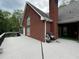 A spacious back deck with outdoor cooking area and a view of the backyard at 349 Bald Rock Rd, Oxford, GA 30054