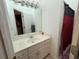 Bathroom featuring white vanity and framed mirror, with a separate door leading to what appears to be the toilet and shower at 349 Bald Rock Rd, Oxford, GA 30054