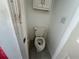 Small water closet with toilet and fresh white paint at 349 Bald Rock Rd, Oxford, GA 30054