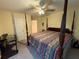 Bedroom featuring a four-poster bed, ceiling fan, and carpeted floor at 349 Bald Rock Rd, Oxford, GA 30054