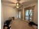 Bedroom featuring a ceiling fan and decorative curtains at 349 Bald Rock Rd, Oxford, GA 30054