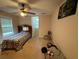 Bedroom with a single bed, window, ceiling fan, and a desk at 349 Bald Rock Rd, Oxford, GA 30054