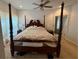 This bedroom features a ceiling fan, natural light and access to the bathroom at 349 Bald Rock Rd, Oxford, GA 30054