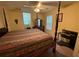 Bedroom with a four poster bed, window with blinds, and dark furniture set at 349 Bald Rock Rd, Oxford, GA 30054