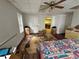 Cozy bedroom with a ceiling fan, hardwood floors, and an exterior door at 349 Bald Rock Rd, Oxford, GA 30054