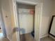 A closet with basic shelving, a rod, and bi-fold doors at 349 Bald Rock Rd, Oxford, GA 30054
