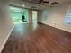 An empty room with plank floors, white walls, and two windows at 349 Bald Rock Rd, Oxford, GA 30054