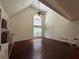 Bright living room features cathedral ceiling, ceiling fan, and built-in shelves at 349 Bald Rock Rd, Oxford, GA 30054