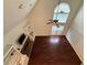 Bright living room featuring hardwood floors, built-in shelving, fireplace, and a high ceiling with fan at 349 Bald Rock Rd, Oxford, GA 30054