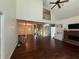 Spacious living room features a ceiling fan, brick fireplace, and open concept floor plan at 349 Bald Rock Rd, Oxford, GA 30054