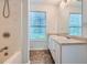 Bathroom with a double sink, walk in shower and tile floor at 1331 Memorial Se Dr, Atlanta, GA 30317
