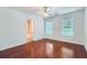 Bedroom with ceiling fan and hardwood floors with bathroom entrance at 1331 Memorial Se Dr, Atlanta, GA 30317