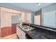 Spacious kitchen with a bar counter overlooking the dining and living areas at 1331 Memorial Se Dr, Atlanta, GA 30317